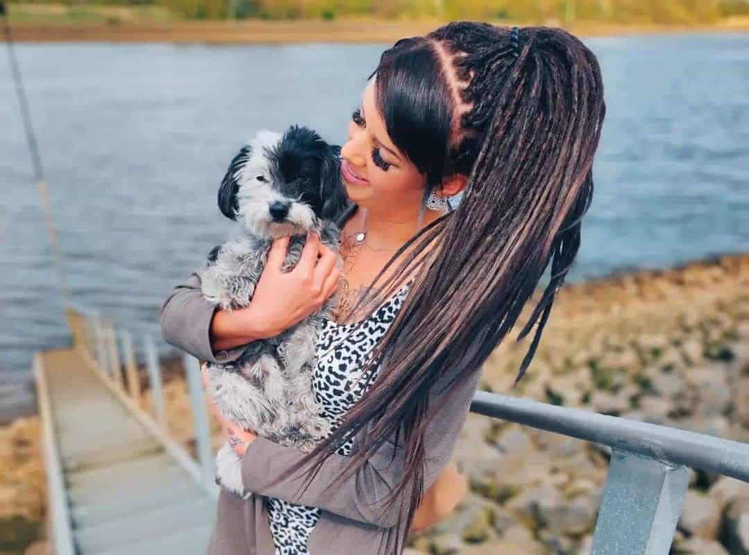 girl with brown hippie dyed dreads and dog