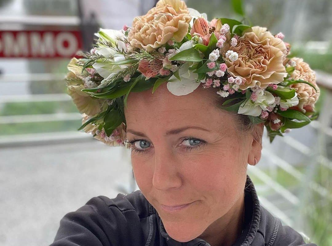 girl with brown pixie cut with flower wreath