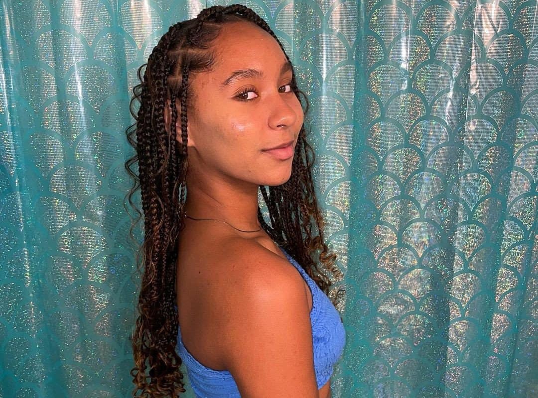 girl with brown stitch braids