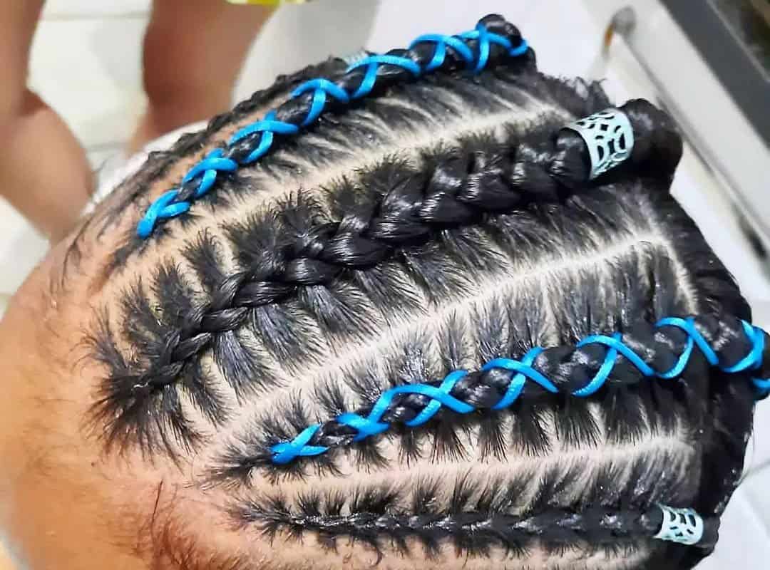 girl with brown thai braids and blue ribbons