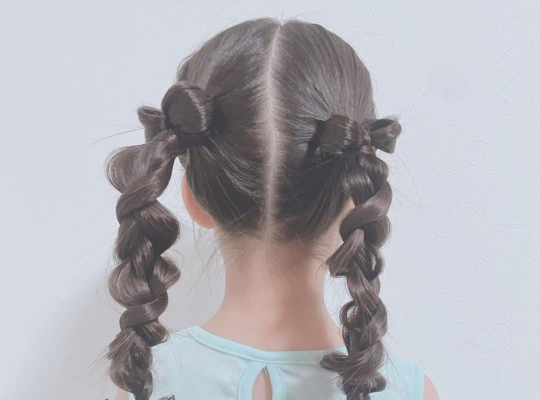 girl with brown cheer pigtails