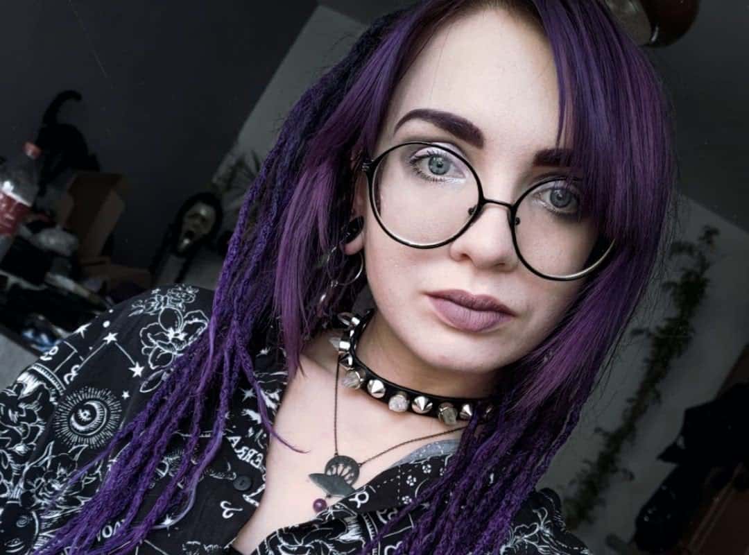 girl with dark purple punk dyed dreads