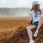 girl in a field with hippie dreads