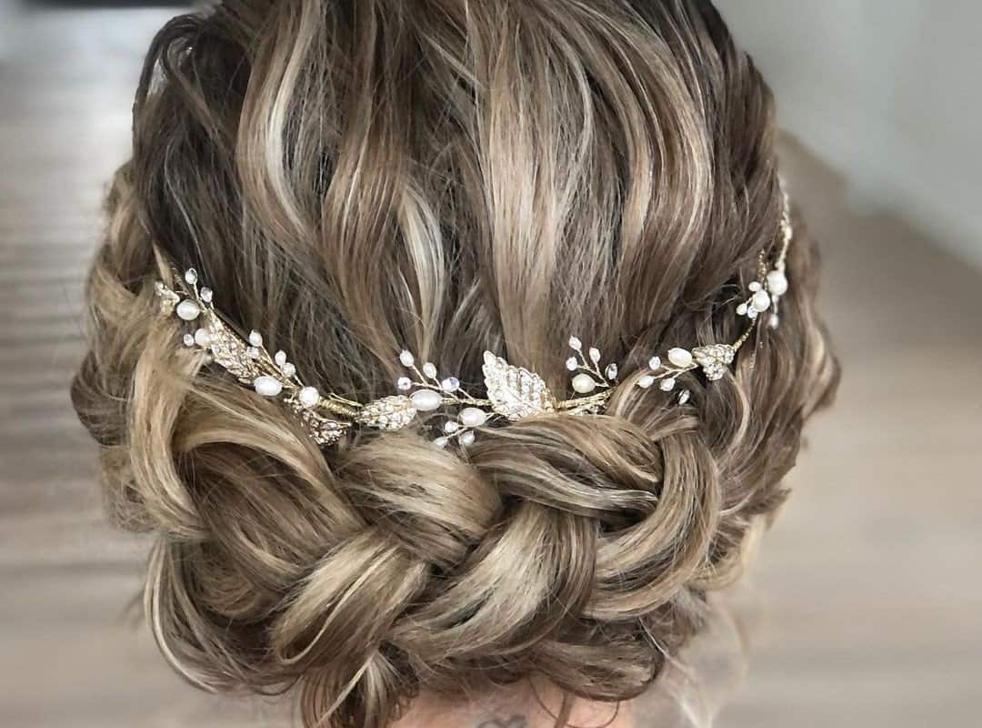 girl with light brown and blonde updo with a decoration