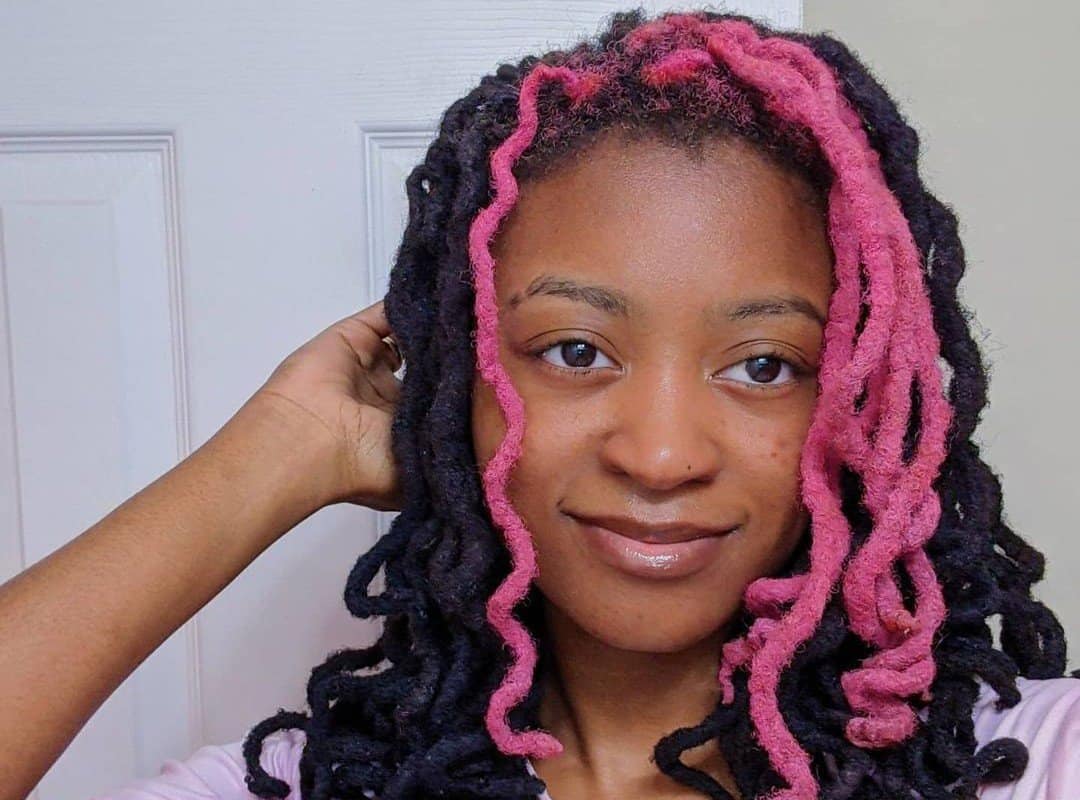 girl with pink and black dyed dreads