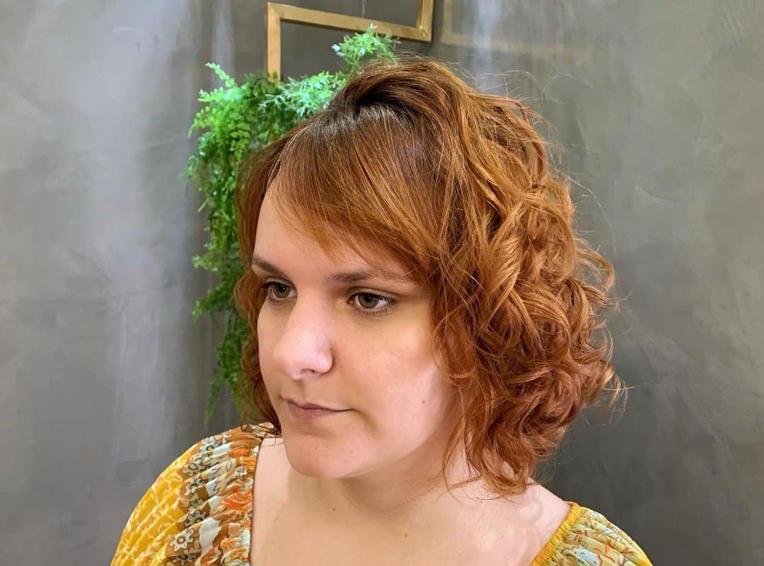 woman with red soft waves aesthetic hairstyle