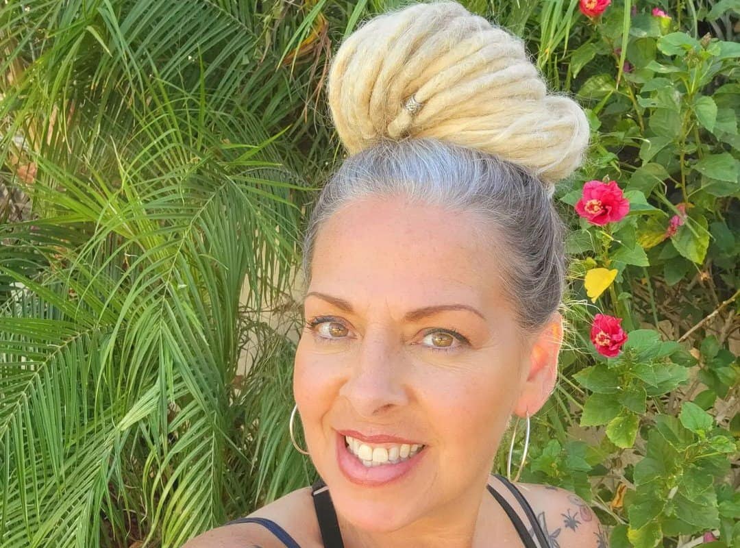 woman with white hippie dreads pulled up